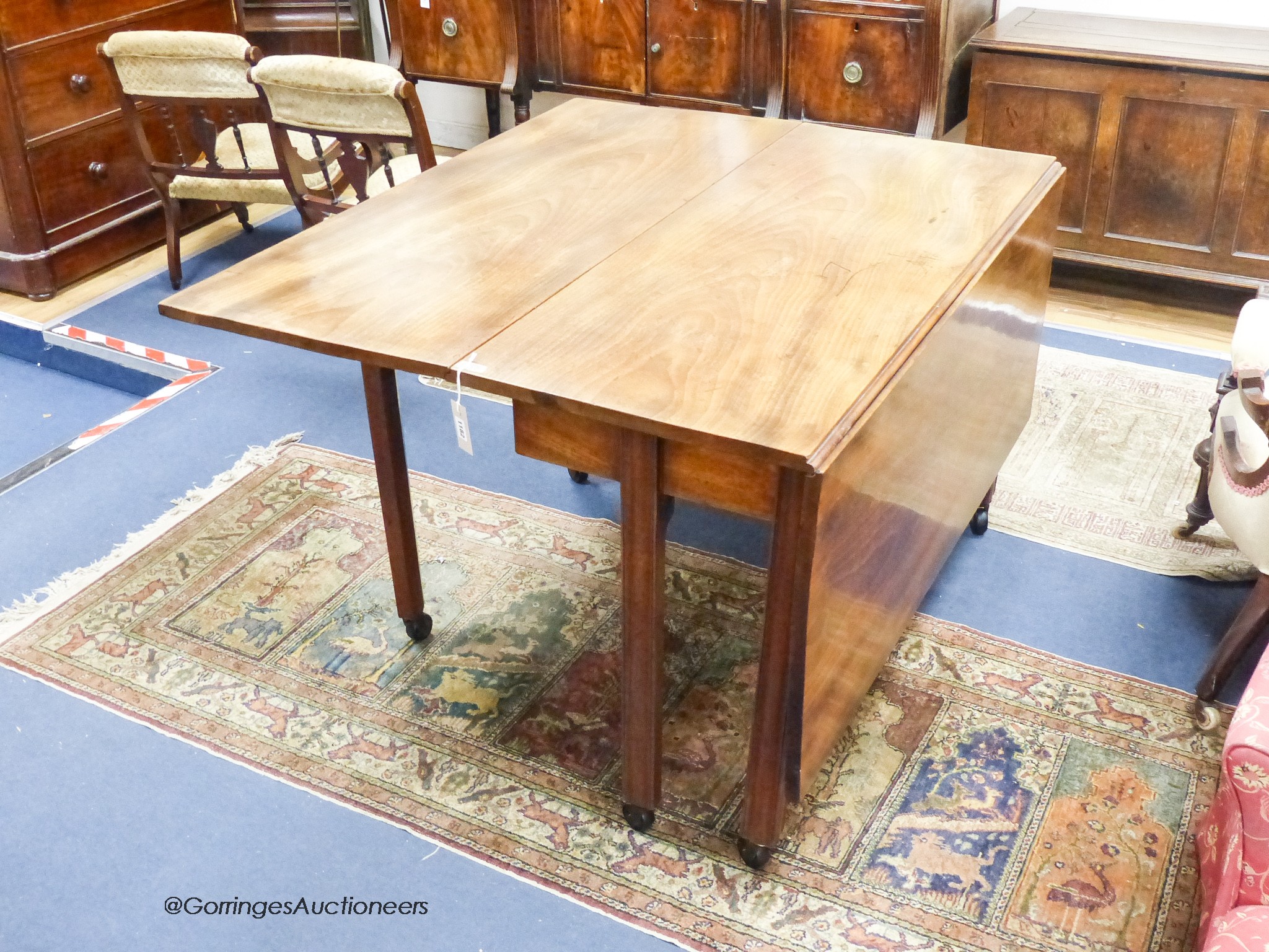 A George III mahogany drop leaf dining table. 151cm extended, D-120, H-75cm